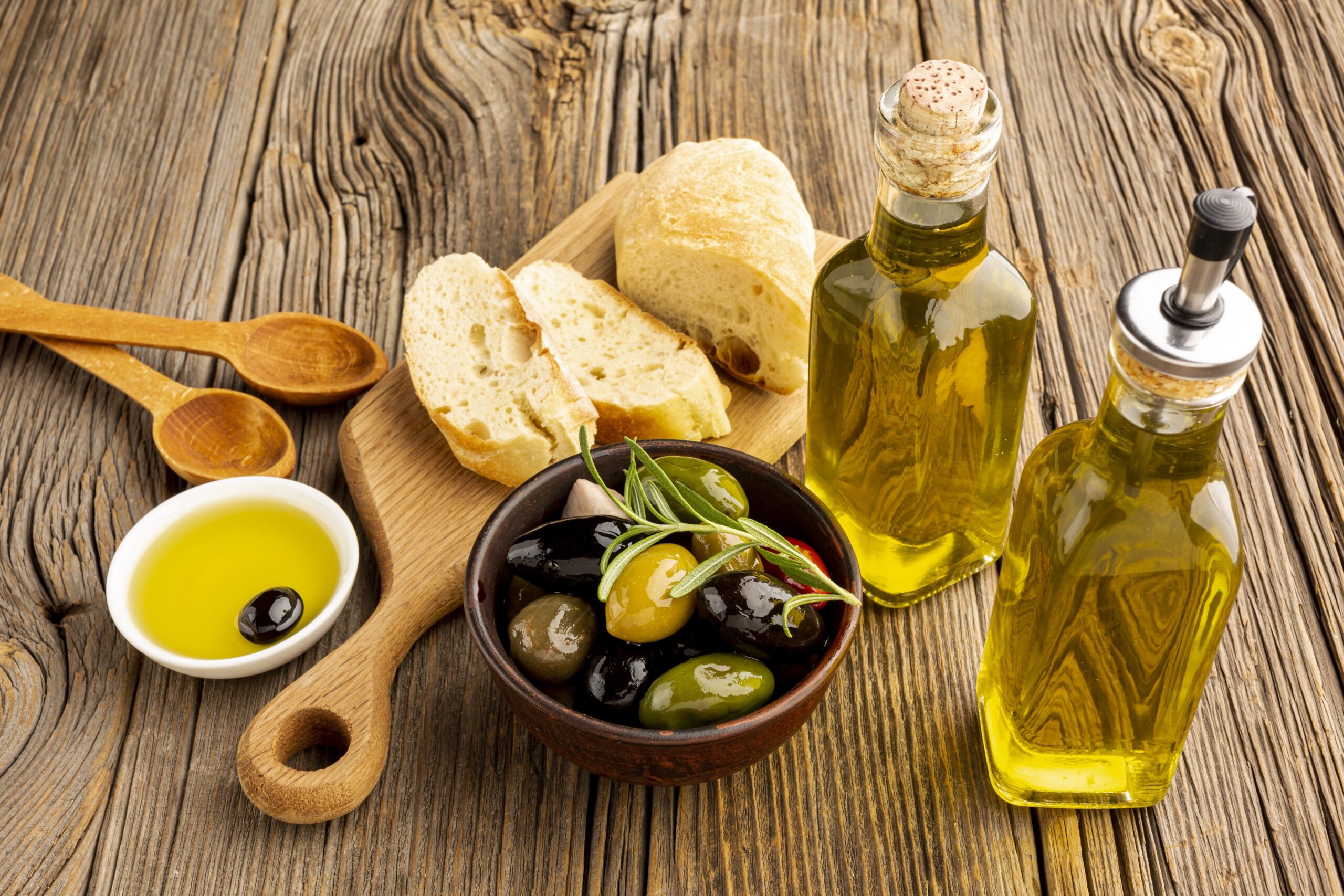 high-angle-olives-mix-bread-oil-bottles (1)